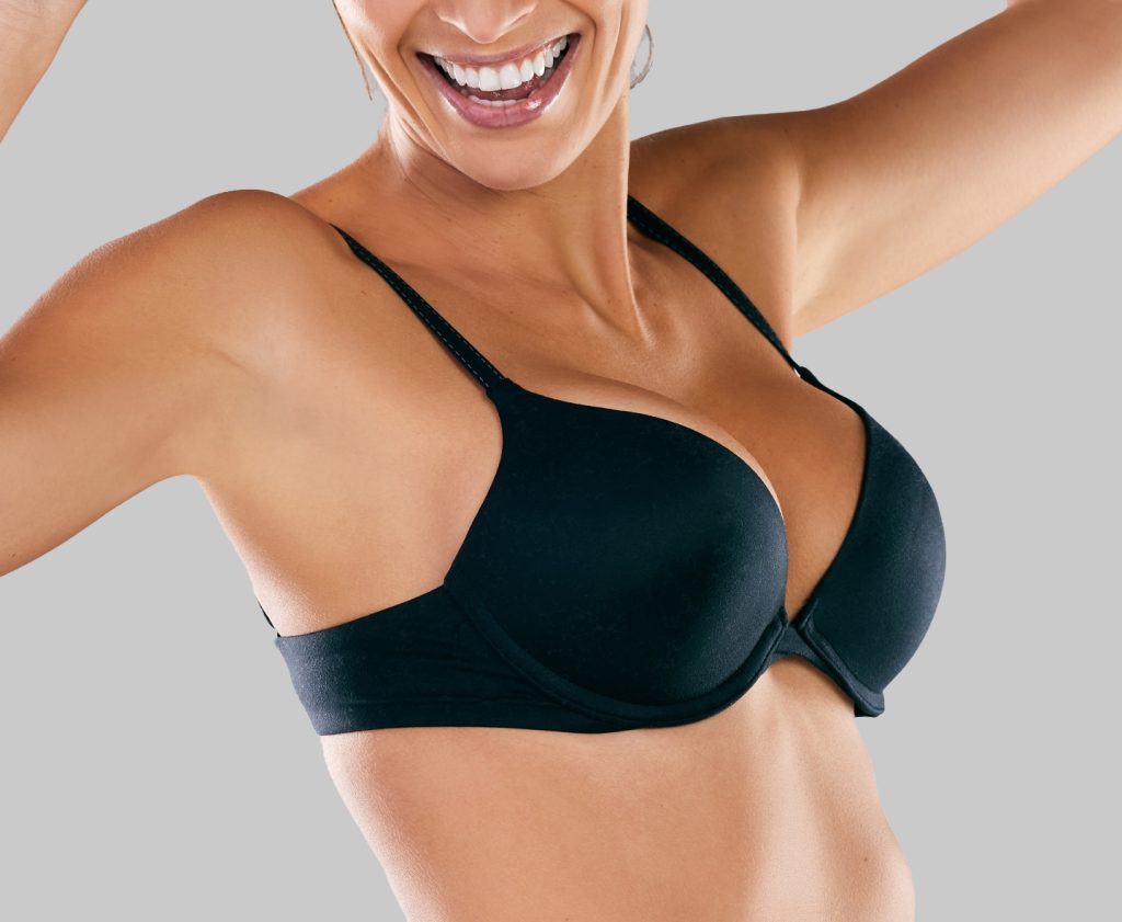 woman smiling in black bra