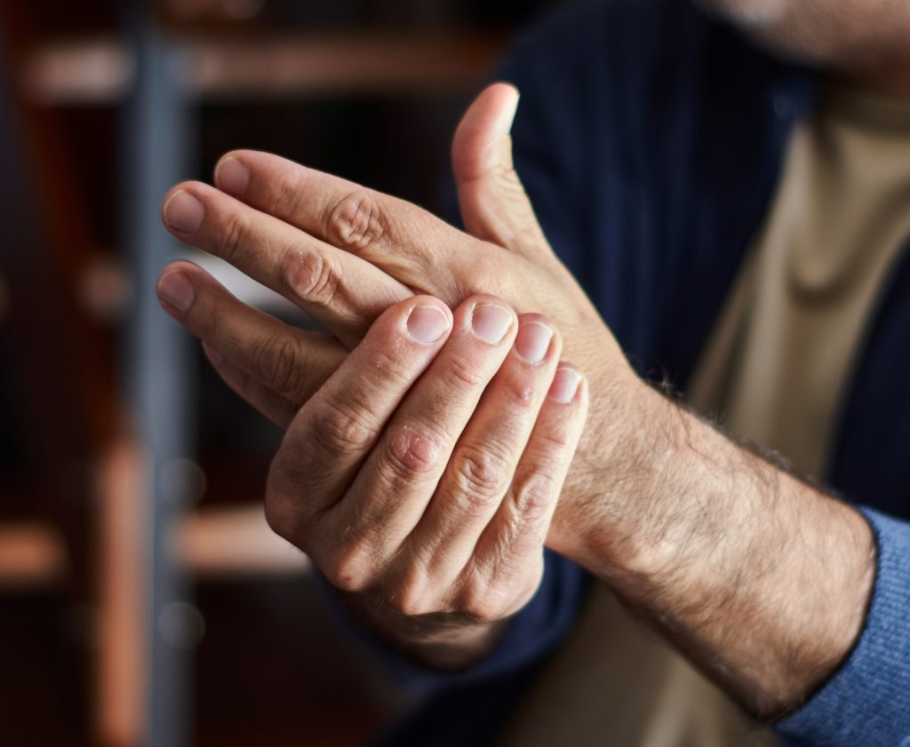A man rubbing his hands