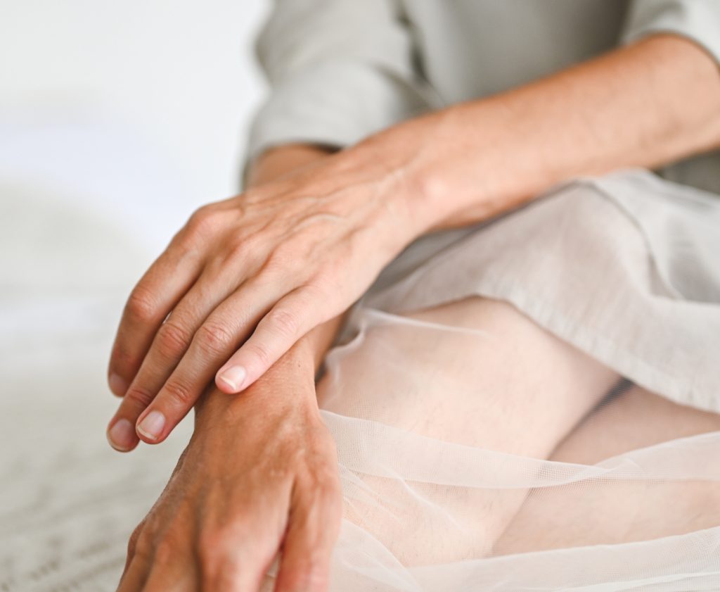 woman caressing her hands